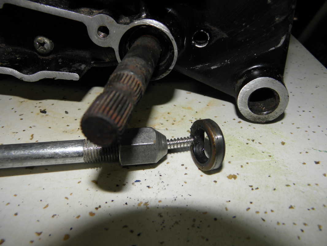 Removing a crankshaft seal using a slide hammer and sheet metal screw
